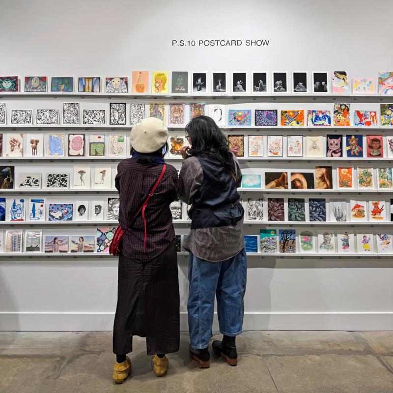 Visitors looking at a wall of postcard-sized artworks at last year’s P.S.10 Postcard Show
